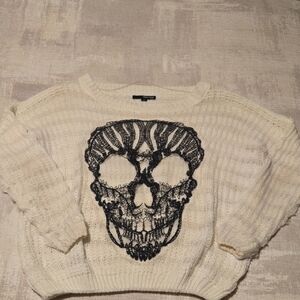 Chic Cream Sweater with Black Skull Motif